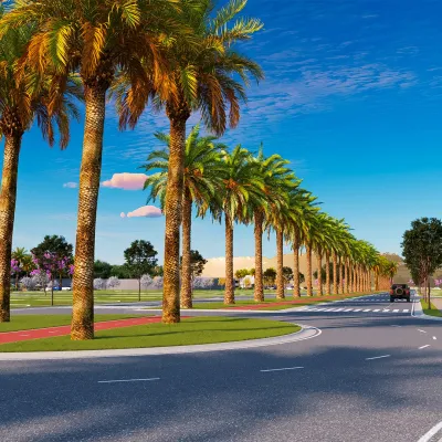Avenida e canteiro central amplos com pista de caminhada.